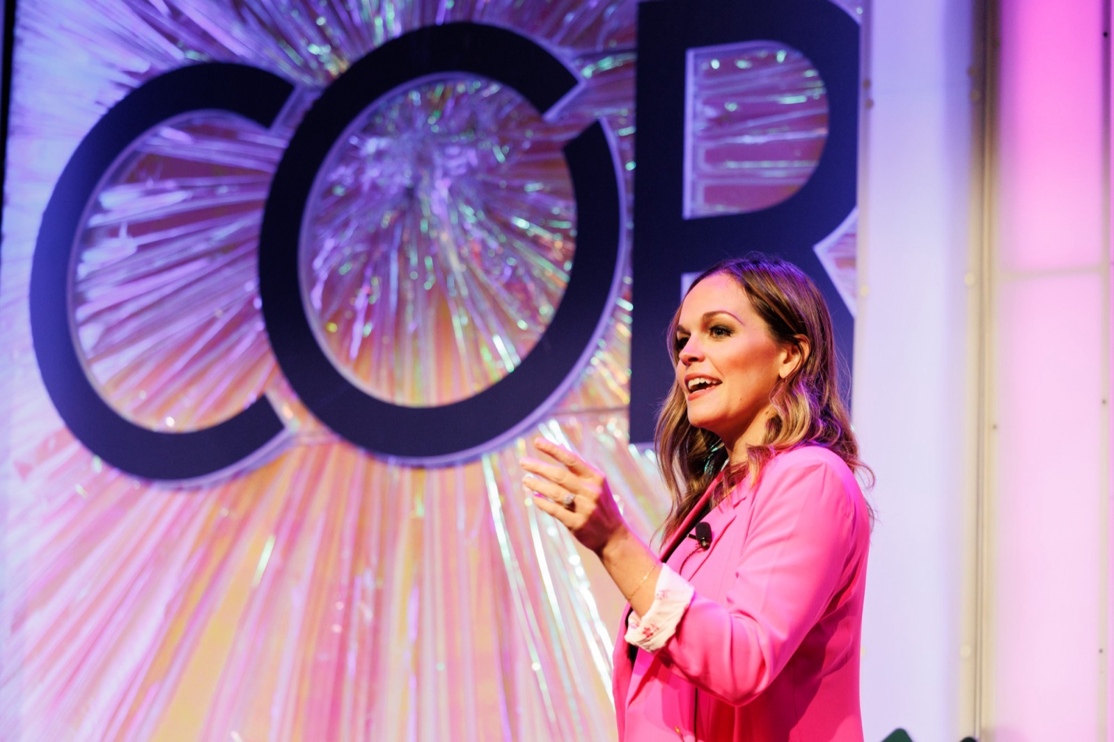 Stephanie speaking on stage